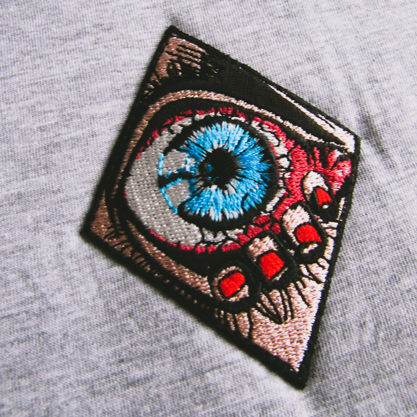 Plain Grey T Shirt With A Sewed On Patch