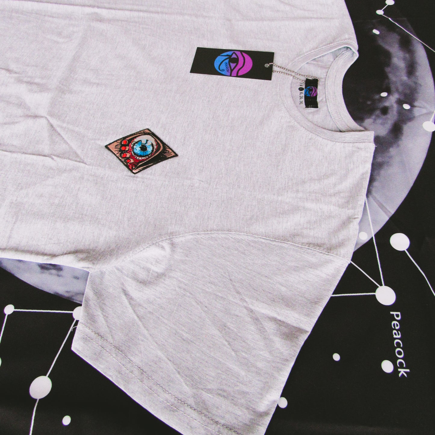 Plain Grey T Shirt With A Sewed On Patch